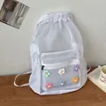 White mesh drawstring backpack with colorful flower applique for a stylish summer look - White