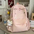 Sweet pink school backpack for girls featuring cute poodle patterns and a plush bow charm - With Charm Style / Pink