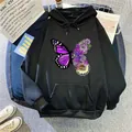 Detail view of the artistic purple butterfly and floral print on a black hooded sweatshirt - S / Tops / Black