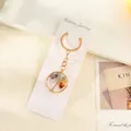 Goldener Lebensbaum-Schlüsselanhänger mit bunten Naturkristallsteinen auf Karte - Rund Gold / 3cm