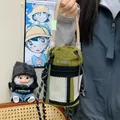 Detailed view of an olive green nylon drawstring bucket bag featuring a mesh front pocket - Green Single Bag