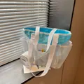Close-up of a white mesh tote bag with a light blue lining and matching pouch - Off White