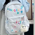 Trendy light blue women's backpack with colorful flower prints and plush star charm - Blue