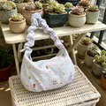 Close-up of a stylish blue gingham shoulder bag with cute bear prints and Fate Astra label - Blue Gingham Cartoon Bear / Blue