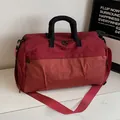 Sac de voyage rouge avec motif à carreaux et poignée noire pour les voyages et le sport - Orange