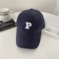 Deep navy blue baseball cap with white embroidered letter P on crown and curved brim - 58-65cm (Adjustable) / Navy Blue
