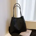 Large capacity black vintage woven shoulder tote bag with a minimalist handmade texture design - Black