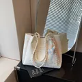 Stylish white star-patterned tote bag with braided straps and cute bunny charm accessory - With Charm / White