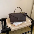 Sophisticated dark brown cross-grain leather handbag for elegant commuting. - Brown