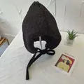Detailed view of black sherpa earflap hat with warm fleece lining and ties for winter - 56-58cm / Black