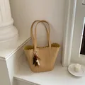 Chic tan woven bucket shoulder bag with decorative beaded tassel and scalloped trim - With Pendant / Yellow