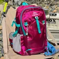 Lightweight waterproof pink and teal outdoor hiking backpack for women in a camping setting - Rose Red