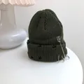 Distressed olive green knit beanie featuring silver rings and safety pin detail - 55-58cm (Elastic) / Army Green