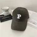 Dark charcoal grey baseball cap with white embroidered P and a wide curved brim style - 58-65cm (Adjustable) / Gray
