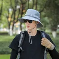 Grey outdoor wide brim sun hat for men featuring breathable mesh and adjustable chin strap - 55-58cm / Gray