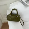 Exquisite woven texture detail of the dark olive green pillow bag for women - Green