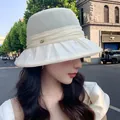 Elegant cream-colored breathable sun hat with ruffled brim shown on an Asian model - 56-58cm / Beige
