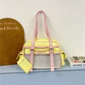 Detailed view of yellow and pink Japanese style kawaii tote bag with mesh pocket and card holder - Yellow