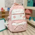 Detailed view of cute pink school backpack with star print and bow accent - With Charm / Pink