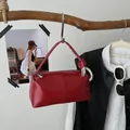 Minimalist retro red pillow handbag with glossy patent leather finish and stylish knot handle detail - Red