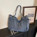 Vintage blue denim tote bag with multiple functional side pockets for daily commuting. - Vintage Blue