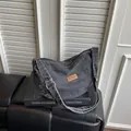 Black washed denim hobo bag with vintage leather patch, adjustable shoulder strap for women. - L / Black