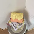 Yellow and orange color-blocked small square crossbody bag with decorative buckles - With Pendant / Orange
