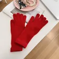 Vibrant red knitted gloves with touch-screen finger openings for winter warmth. - Stretchy / Red