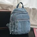 Stylish light blue denim multi-pocket commuter backpack for women featuring fringe tassels - Light Blue