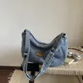 Adjustable blue denim hobo shoulder bag with a vintage wash and sport patch detail - S / Blue