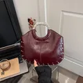 Chic wine red glossy patent leather handbag with silver studs and metal handle - Red