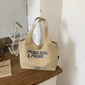 Bolso tote informal de lona beige para mujer con eslogan bordado en azul chic - Caqui