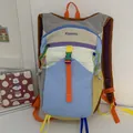 Close-up detail of a colorful dopamine style hiking backpack featuring multi-pocket design - Backpack / Large Capacity / White with Blue