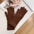 Warm brown knitted winter gloves for women featuring touchscreen compatible finger slits - Stretchy / Coffee