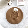 Close-up of a brown knit beret with a Season 13 letter patch on a white fuzzy rug. - 55-60cm / Khaki