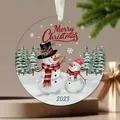 Detail view of round acrylic Christmas ornament with cute snowman watercolor design - Snowman in Snow (6) / 8x8x0.3cm