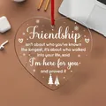Close-up of heart-shaped acrylic ornament with friendship quote and red ribbon - Friendship Quote (16) / 8x8x0.3cm
