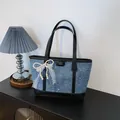 Stylish blue denim tote bag with black handles and elegant white lace pearl bow decoration - With Charm Style / Black