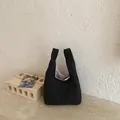 Casual black and white checkered fabric bucket bag with a stylish minimalist design - Black