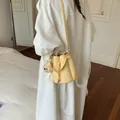 Elegant yellow summer bucket bag with drawstring closure and cute bear plush charm - With Charm / Yellow