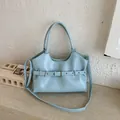Elegant light blue women's tote bag featuring unique decorative belt buckle detail design - Blue