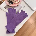 Cozy purple knitted winter gloves for women featuring touch screen finger openings - Stretchy / Purple