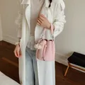 Fashionable pink textured leather bucket bag for women with a cute white plush bear charm - With Charm / Pink