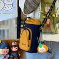 Trendy navy blue and mustard yellow drawstring bucket bag with cute cat plush charm - With Charm Style / Navy Blue/Yellow