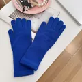 Bright blue knitted touchscreen gloves featuring finger openings for winter warmth and grip - Stretchy / Sapphire Blue