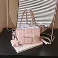 Elegant pink woven small square underarm handbag featuring a star charm and strap - Pink