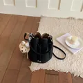 Black pebbled leather bucket bag with cute teddy bear charm accessory - With Charm / Black