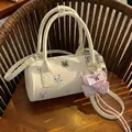 Elegant white cylindrical women's handbag featuring cute cat prints and a pink heart charm - White with Pendant
