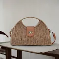 Detailed view of a handmade paper rope woven dumpling bag with a vintage metal lock - Buckle Dumpling Bag / Brown