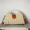 Detailed view of handmade paper rope woven dumpling bag with vintage leather strap - Buckle Dumpling Bag / Beige